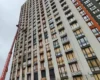 Забиті OSB-плитами вікна: який вигляд має висотка в Дарницькому районі після атаки 12 жовтня